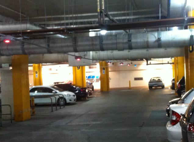 Great Aussie Idea #4: lights above parking spaces. Red=occupied, green=hurry up and snatch it. Why didn't I think of this?